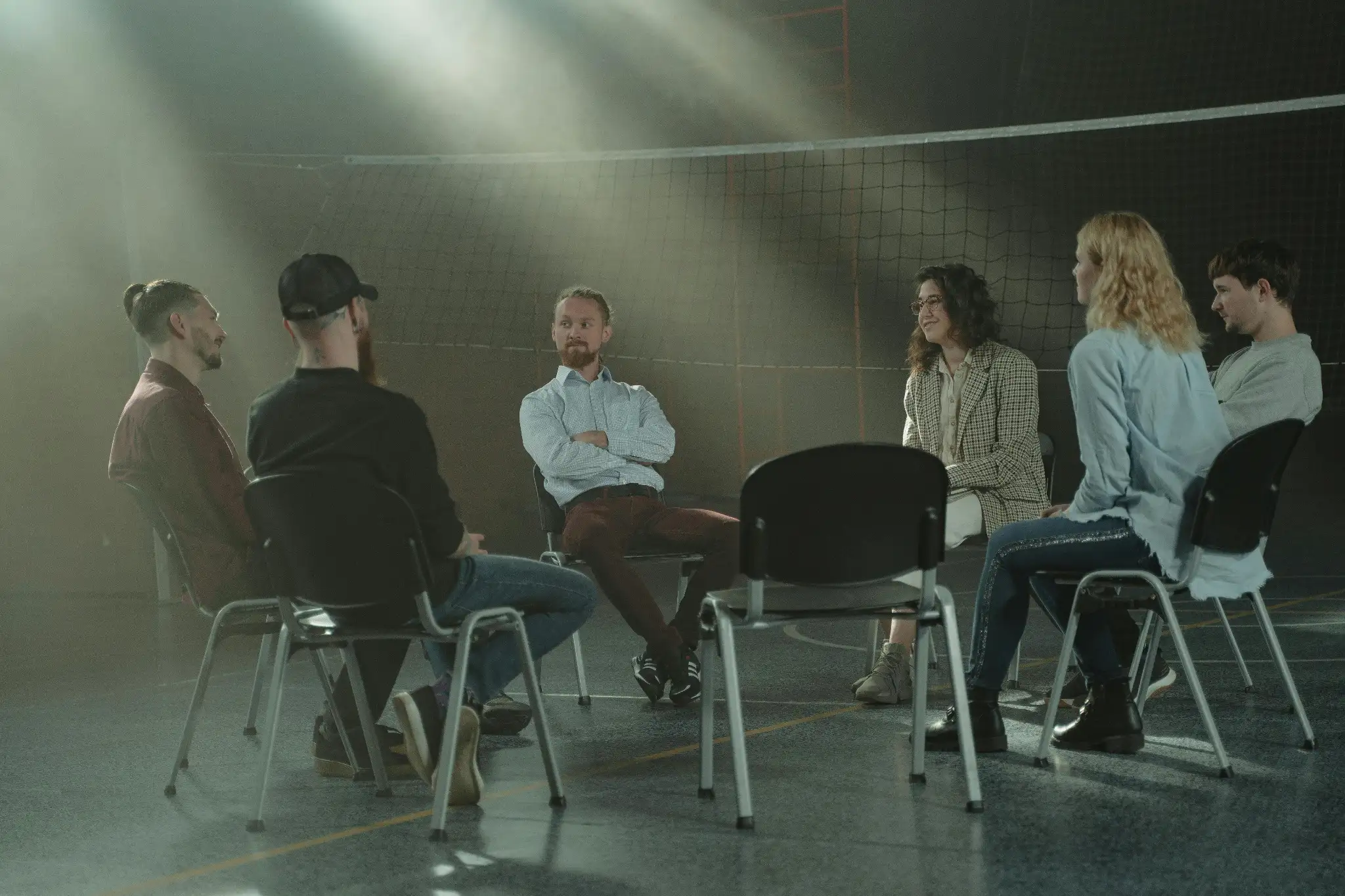People participating in a group reflection session as part of a team building activity in Spain